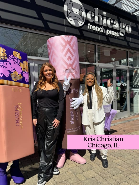 Two people stand with giant Tarte Cosmetics product mascots outside a café named chicago french press. Sign shows address 1021. The text reads Kris Christian Chicago, IL.