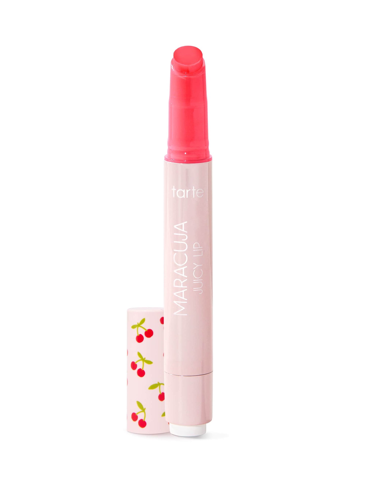 A pink cylindrical lip product stands upright, its cap off to the side with small cherries on it, set against a plain white background.