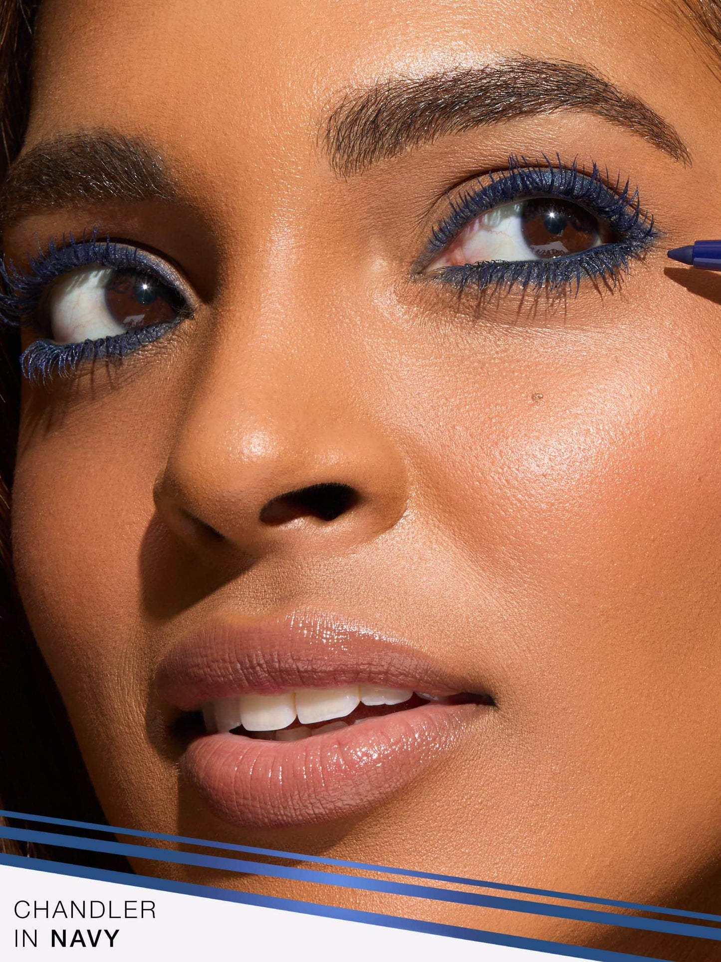 Close-up of a person wearing navy eyeliner with 'Chandler in Navy' text at the bottom.