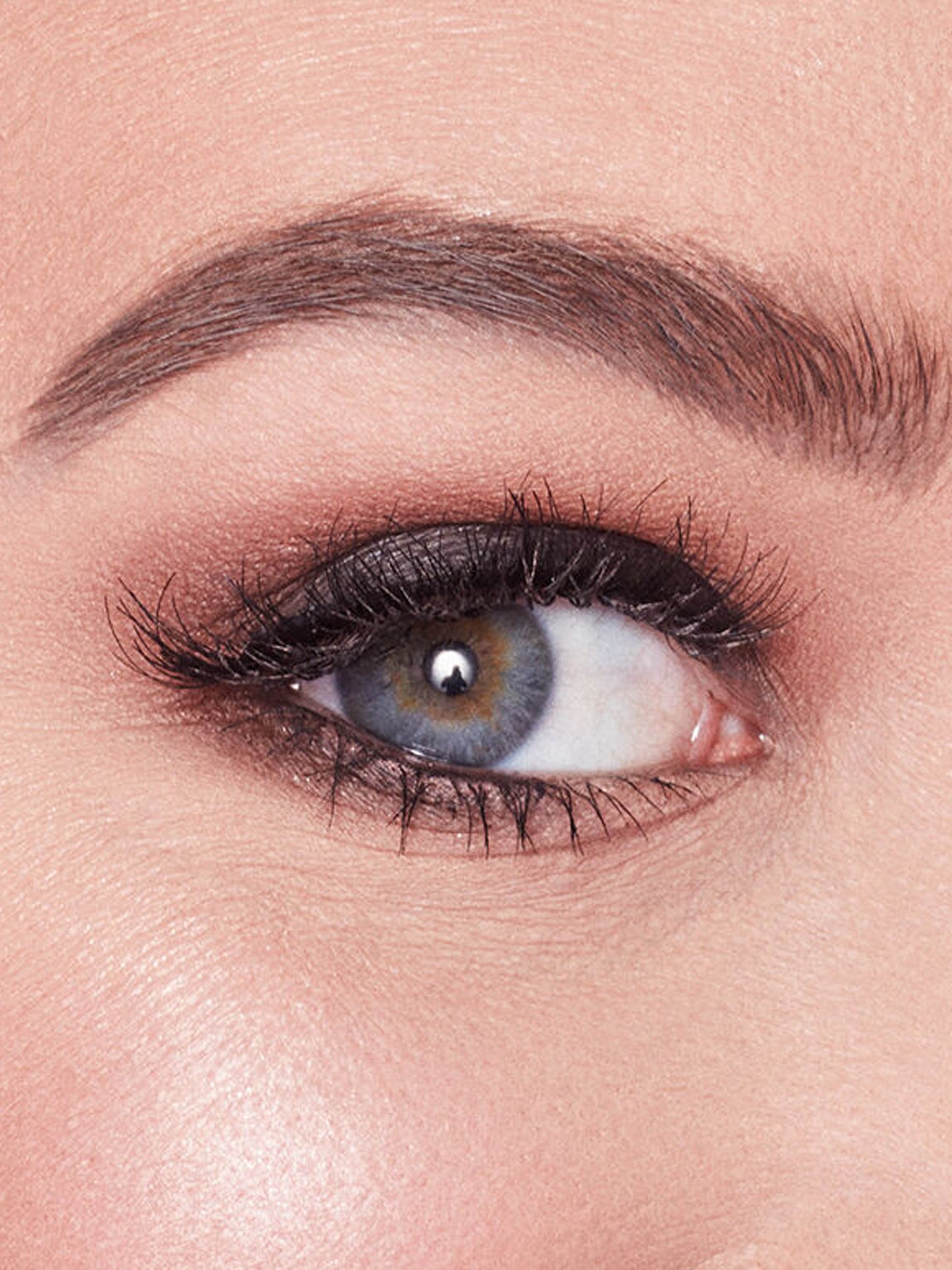 Close-up of a person's eye with smoky eye makeup