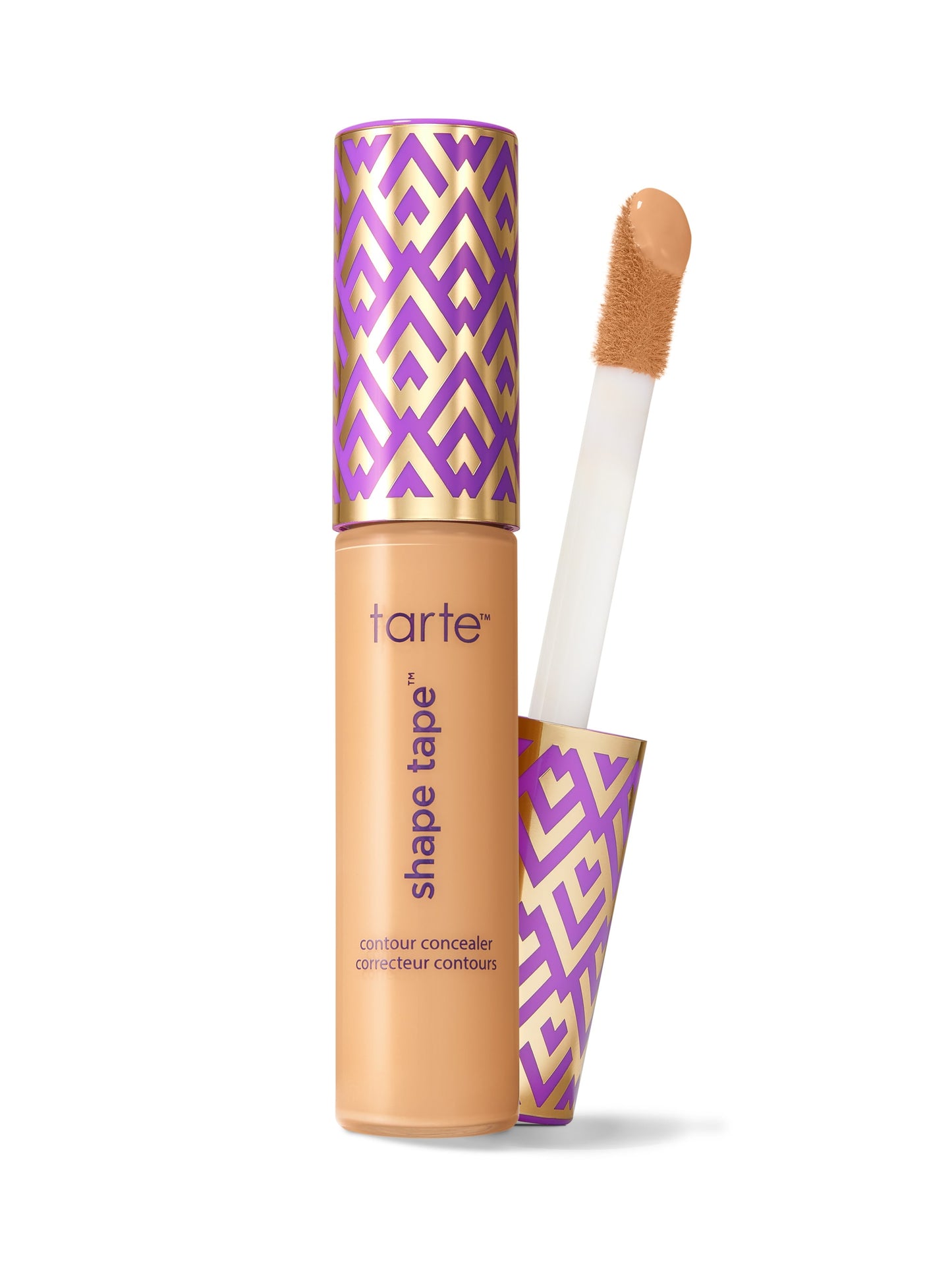 Tarte Shape Tape contour concealer tube with applicator wand lifted, tip coated in product; purple-and-gold patterned cap and base on a white background. Text: tarte™; shape tape™; contour concealer; correcteur contours